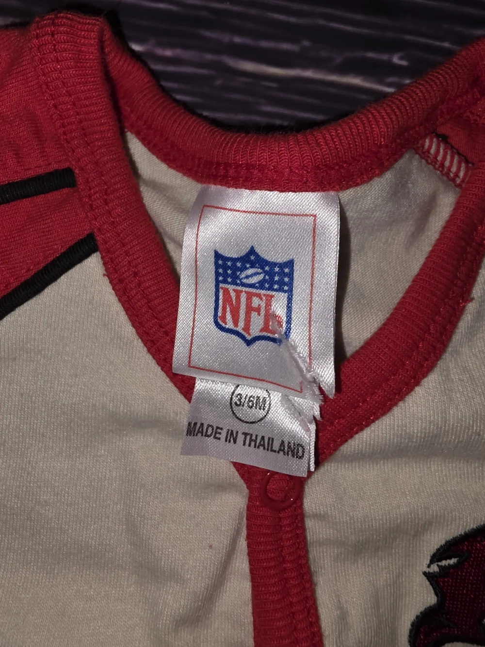 NFL Baby Footed One-Piece in White and Red with Buccaneers Logo